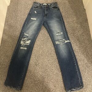 Buckle High Rise Distressed Blue Jeans